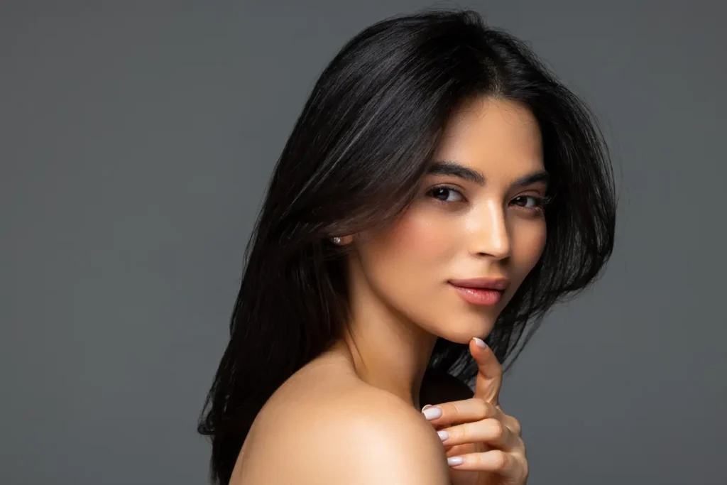 Close-up of a woman with smooth, radiant skin, showcasing results from Alma Hybrid laser treatment at Adult Health N.P. PLLC